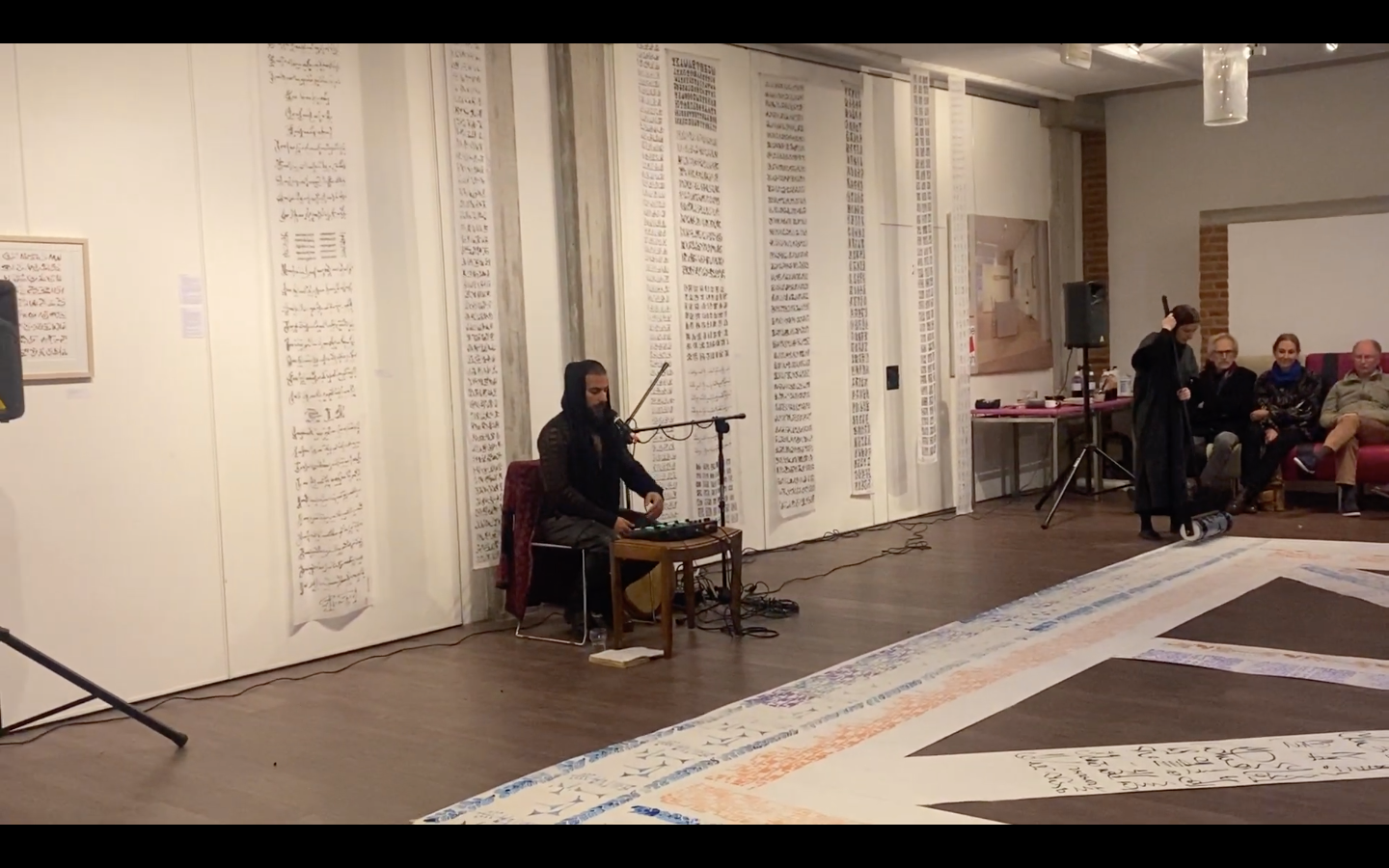 Load video: Curator: Ahmad Mallah. Performance: Mark van Praagh and Astera Mortezai. Vocal and sound Performance: Wasim Arslan. Gallery de Ploegh, Amersfoort NL 11-12-2022